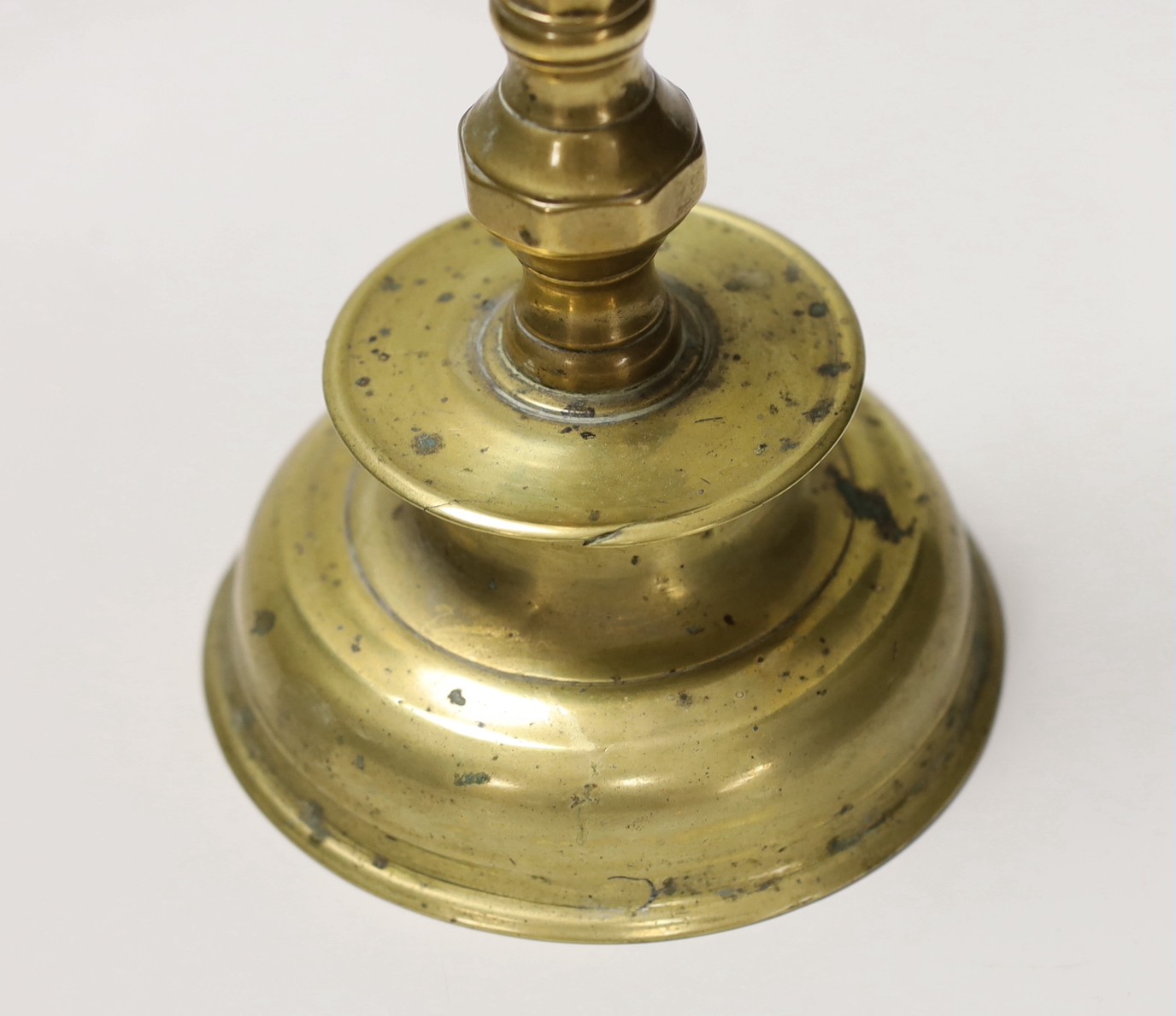 A 17th century continental brass candlestick. 28cm high